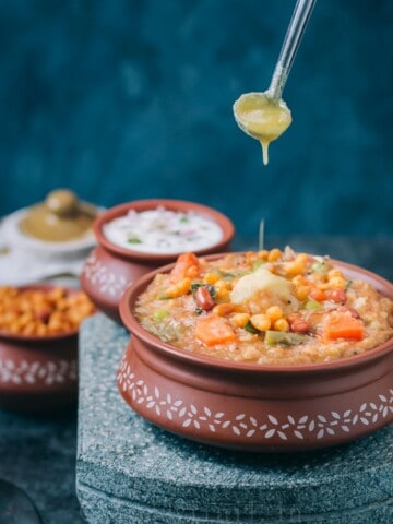 bisi bele bath recipe served in earthen pots