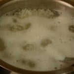 Cooking soaked jeera rice for ambut chicken biryani preparation