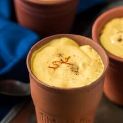 Mango lassi recipe is mango yogurt thick drink served in earthen glass