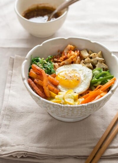 vegetarian Korean bibimbap with chop sticks on side