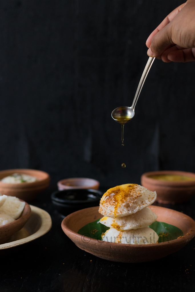 Idlis stacked up and ghee drizzled on top