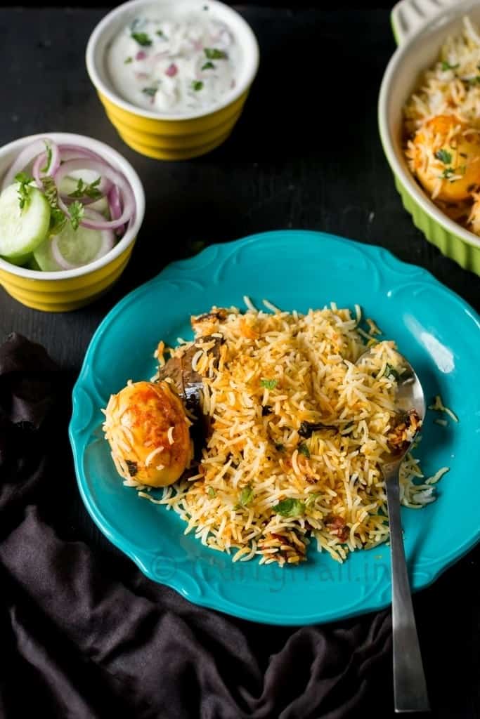 Hyderabadi dum biryani with eggs in plate 