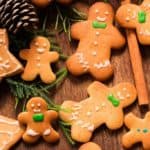 different sized gingerbread man cookies on wooden tray