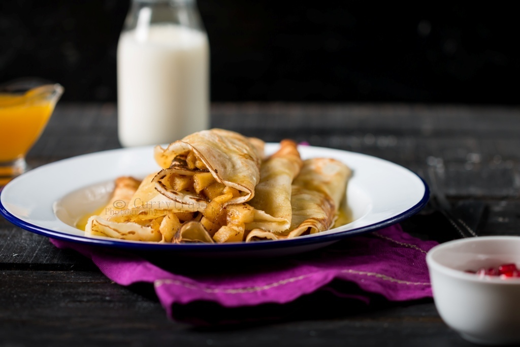 Crepes Filled With Apples & Topped With Orange Sauce