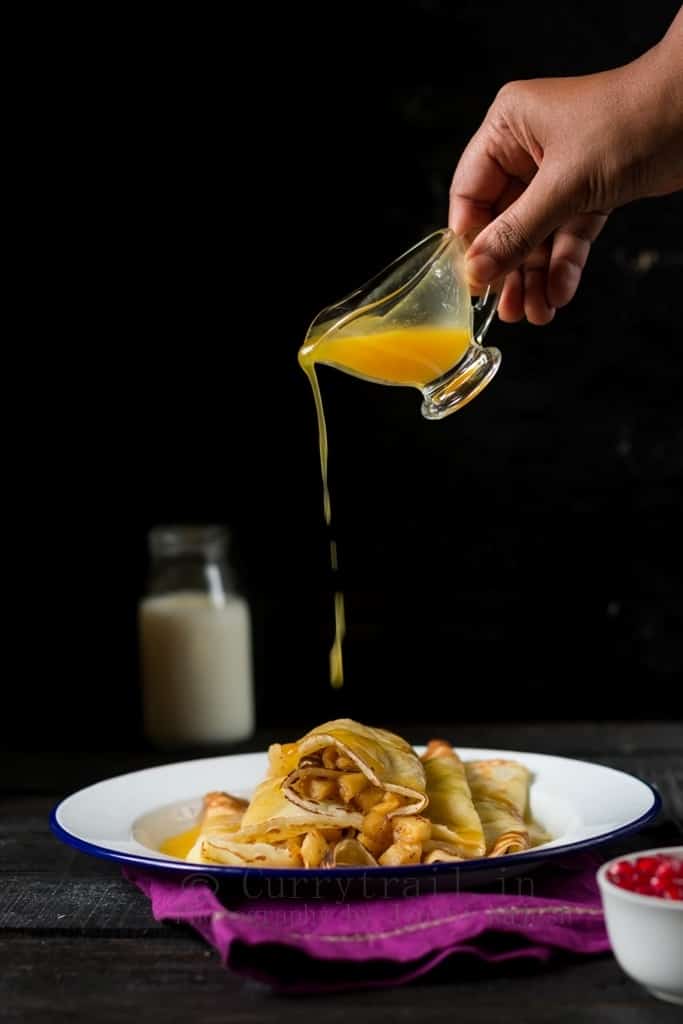 Crepes Filled With Apples & Topped With Orange Sauce