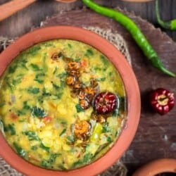 dal palak served in earthen pots is simple dal recipe with goodness of spinach