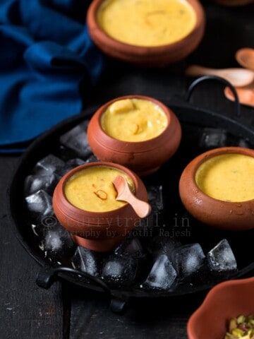 rich Indian mango ice cream served in earthen pots