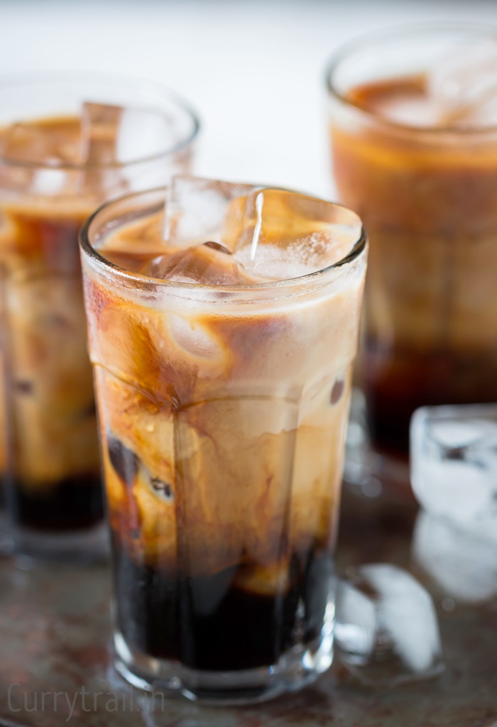 Chilled glasses with iced coffee 