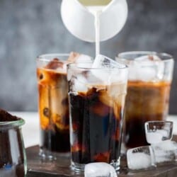 Pouring half and half for iced coffee recipe