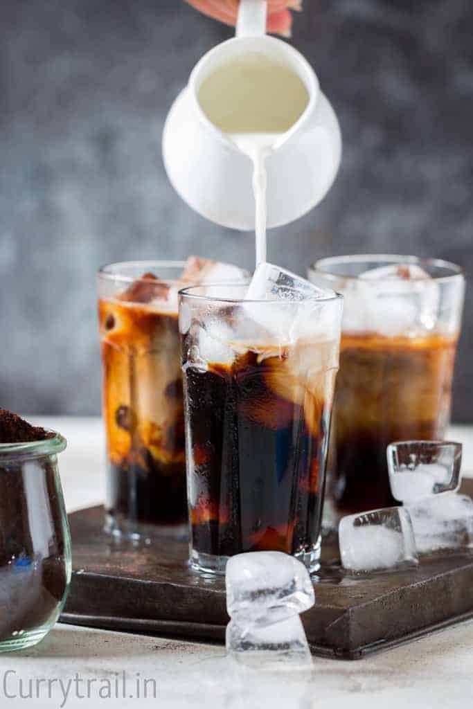 Pouring half and half for iced coffee recipe