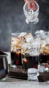 Pouring simple syrup for iced coffee recipe