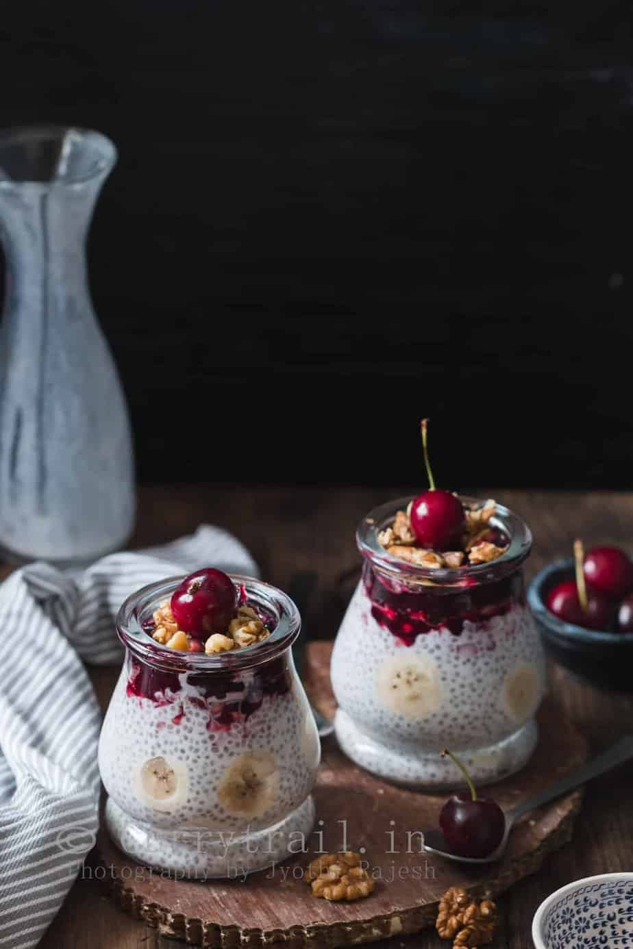 creamy chia breakfast pudding topping with cherry compost and walnuts