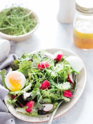 fresh spring salad made from fresh spring mix of tender greens with orange vinaigrette