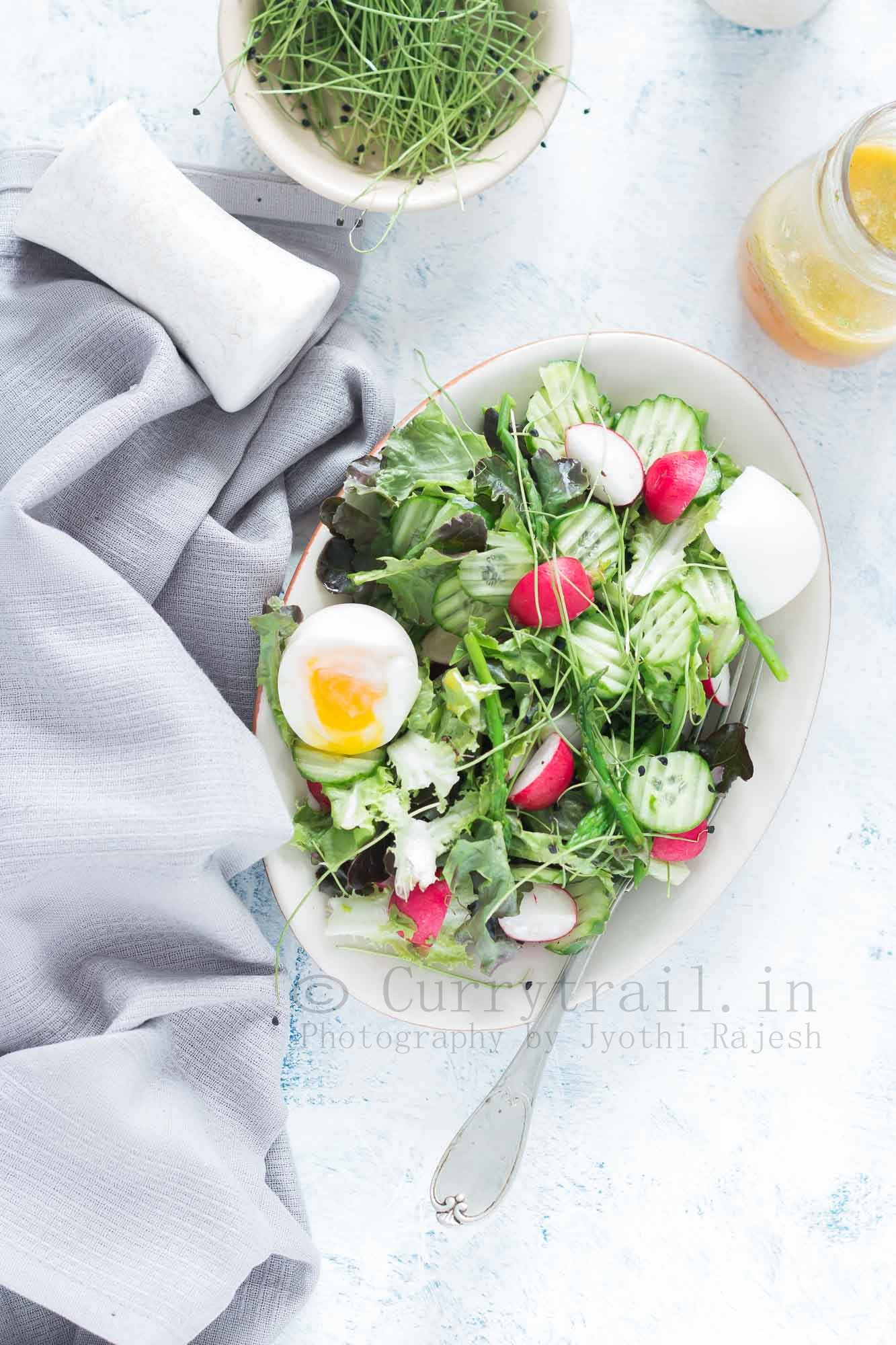 fresh spring salad made from fresh spring mix of tender greens with orange vinaigrette 