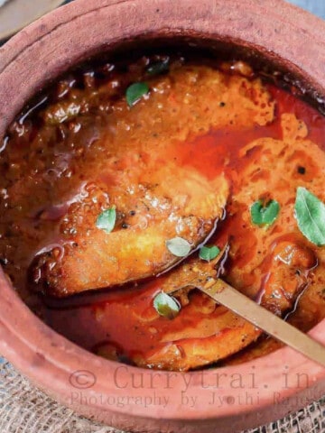 Kerala style fish curry in clay pot.