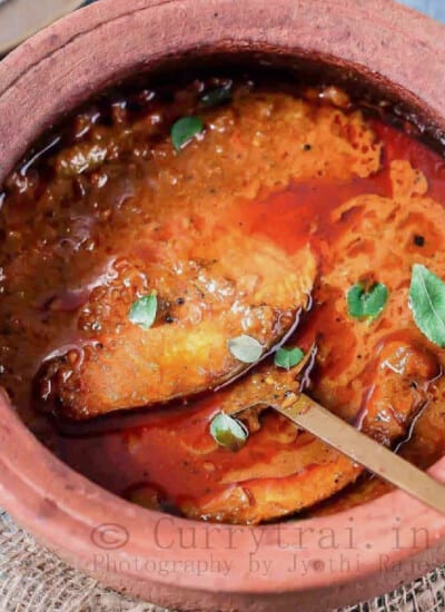 Kerala style fish curry in clay pot.