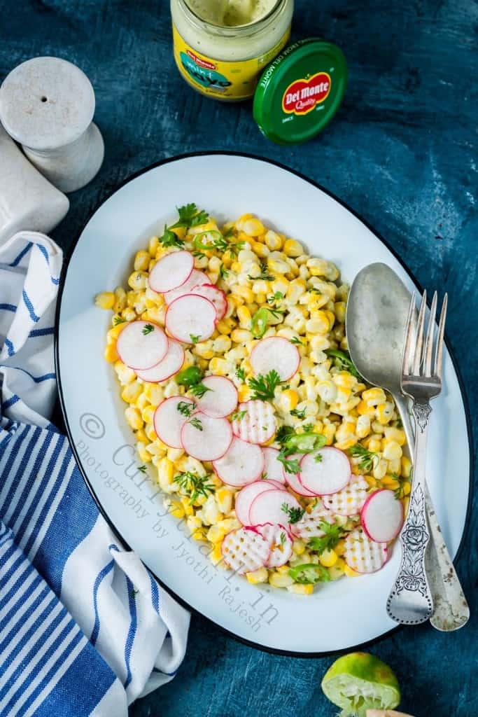 creamy corn salad with mayonnaise served in white plate