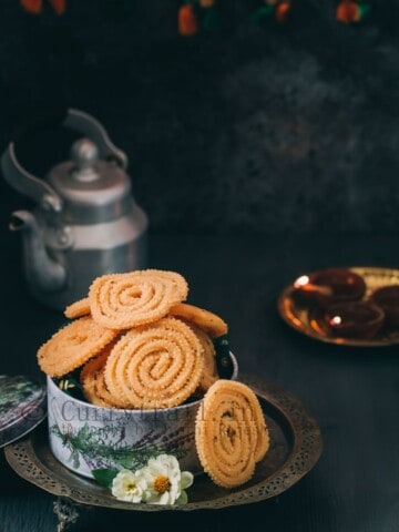 super crunchy butter murukku served in tin boxes