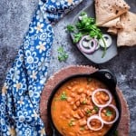 rajma masala is rich, creamy, spicy red bean curry served in cast iron pan