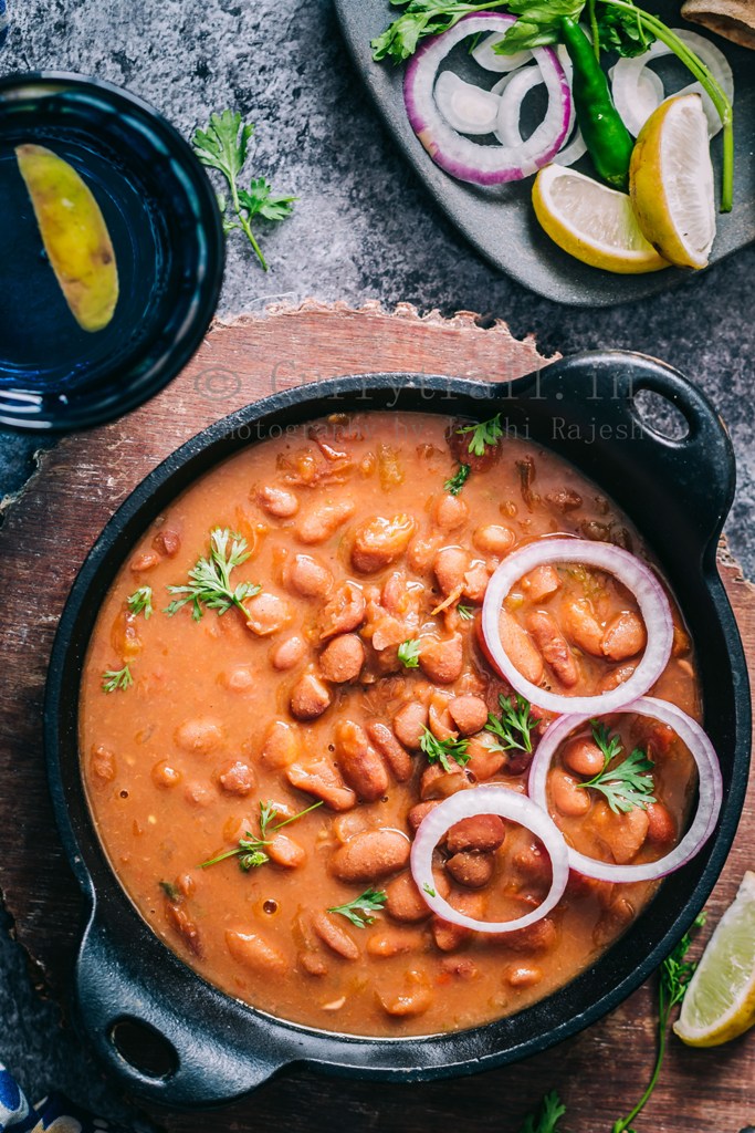 rajma masala is rich, creamy, spicy red bean curry served in cast iron pan