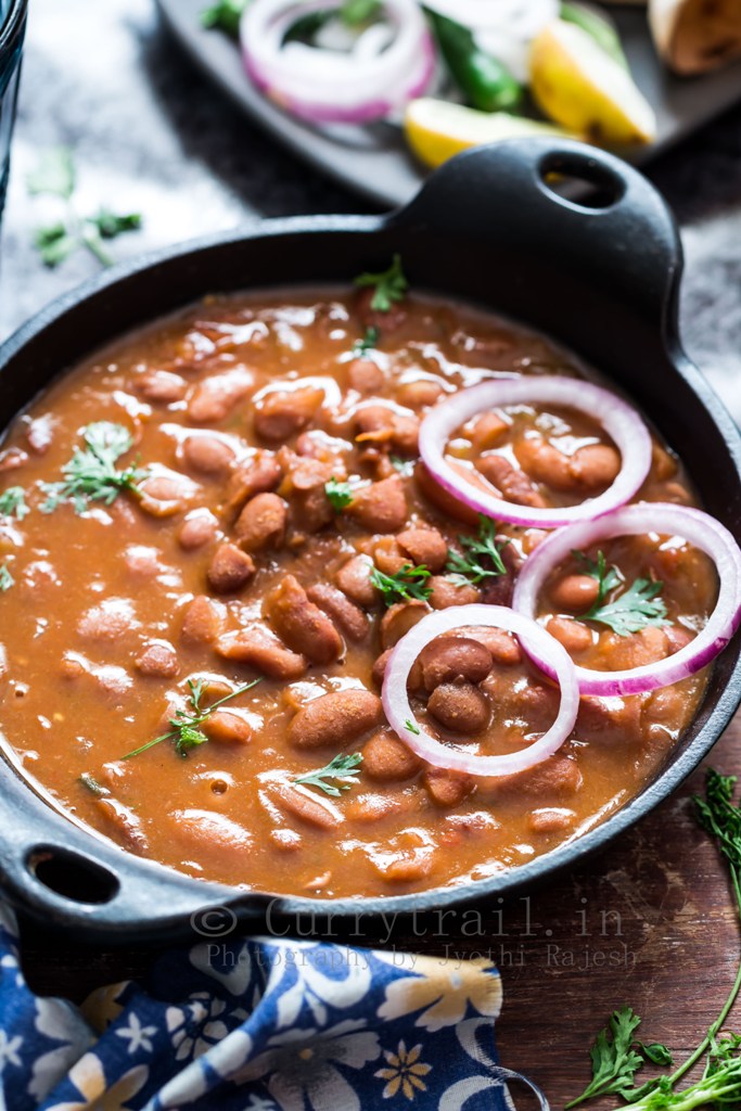 rajma masala is rich, creamy, spicy red bean curry served in cast iron pan
