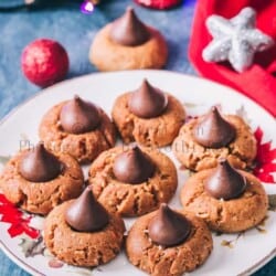 peanut butter kiss cookies are soft chewy cookies that's great for cookie exchange during the holidays. Soft cookies made of peanut butter and topped with chocolate kiss candy at the center is a classic holiday cookie