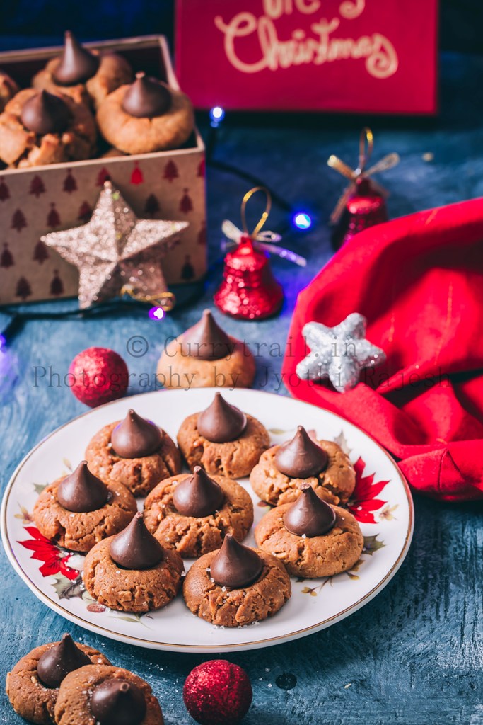 peanut butter kiss cookies are soft chewy cookies that's great for cookie exchange during the holidays. Soft cookies made of peanut butter and topped with chocolate kiss candy at the center is a classic holiday cookie