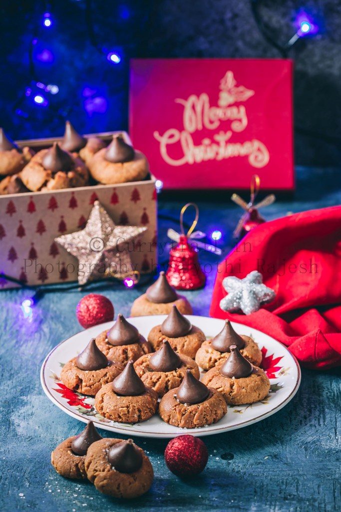 peanut butter kiss cookies are soft chewy cookies that's great for cookie exchange during the holidays. Soft cookies made of peanut butter and topped with chocolate kiss candy at the center is a classic holiday cookie