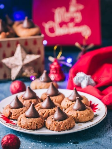 peanut butter kiss cookies are soft chewy cookies that's great for cookie exchange during the holidays. Soft cookies made of peanut butter and topped with chocolate kiss candy at the center is a classic holiday cookie