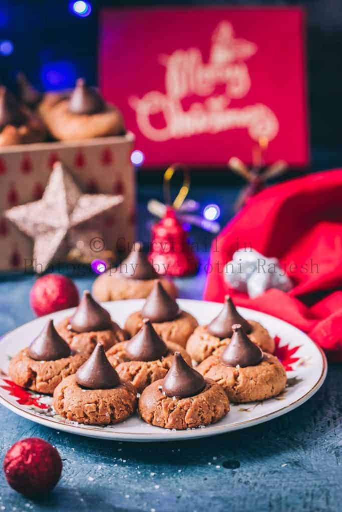 peanut butter kiss cookies are soft chewy cookies that's great for cookie exchange during the holidays. Soft cookies made of peanut butter and topped with chocolate kiss candy at the center is a classic holiday cookie