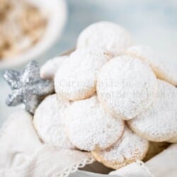 cashew snow cookies in white cookie jar