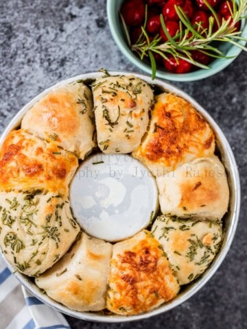 cheese herbs savory pull apart bread on baking dish