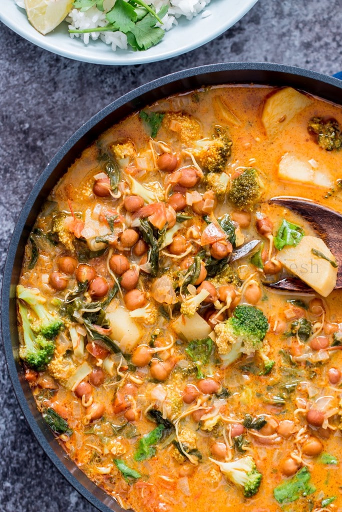 overhead bowl of  vegetable chickpea curry soup