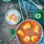 dhaba style anda curry served in skillet with rice on side