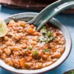 Thick Moroccan harrira soup served green bowl