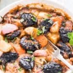 Vegetable tagine with prunes in white casserole
