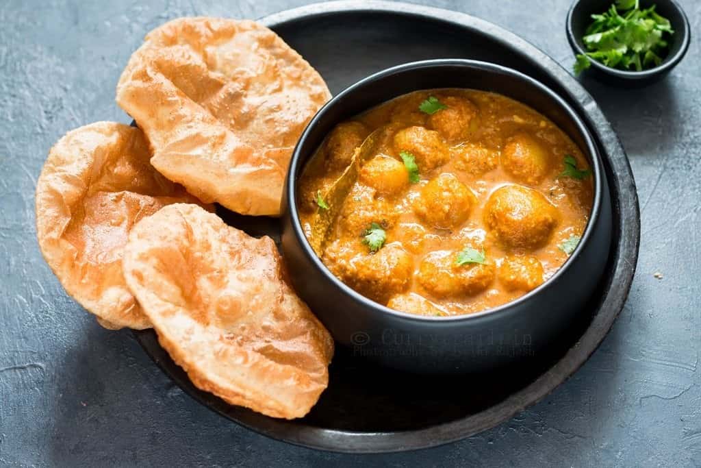 Dum Aloo served in black bowl