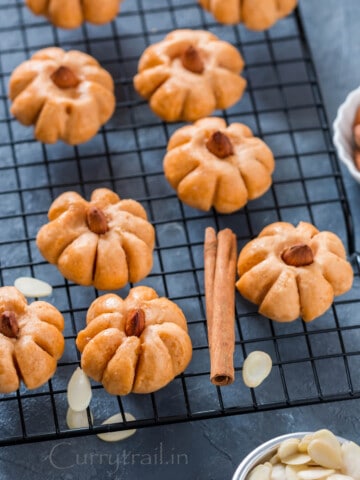 shaped like pumpkin - pumpkin cookies on wire mesh