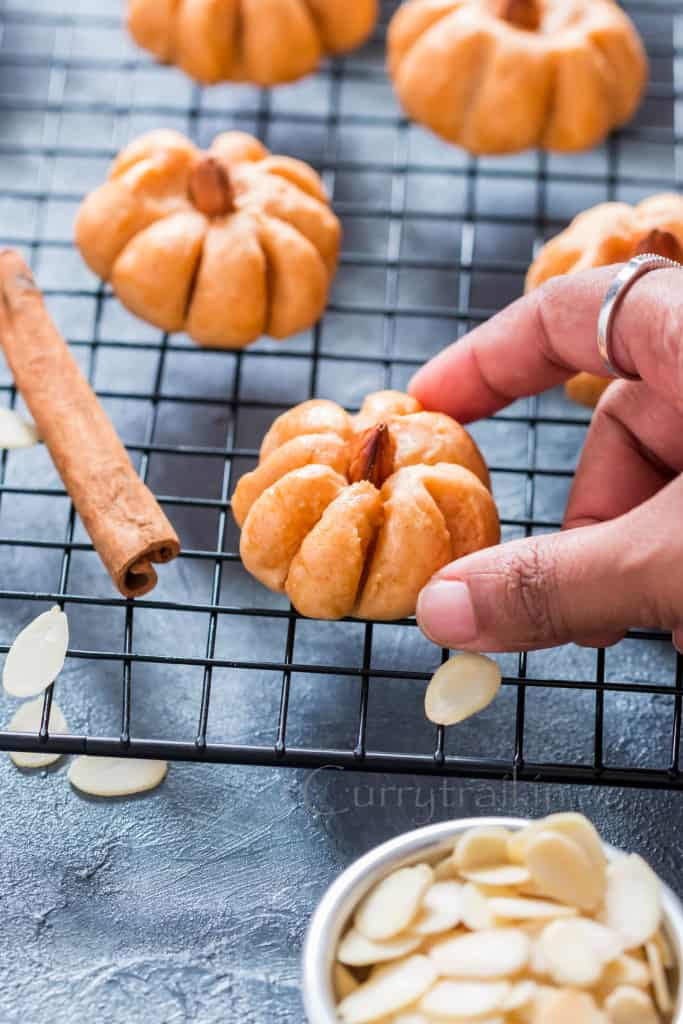 pumpkin shaped cookies on wire rack