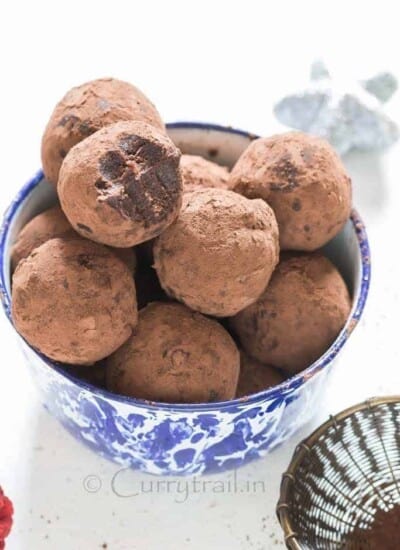 Christmas Rum Balls served in blue bowl is simple to make and guaranteed to wow your guests