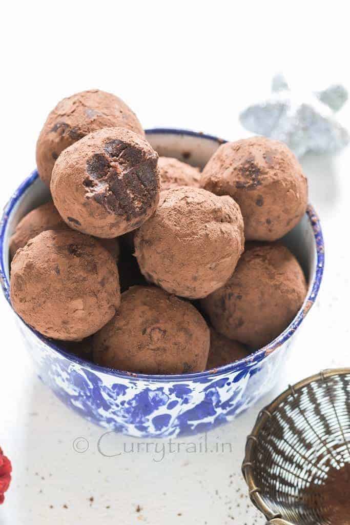 Christmas Rum Balls served in blue bowl is simple to make and guaranteed to wow your guests