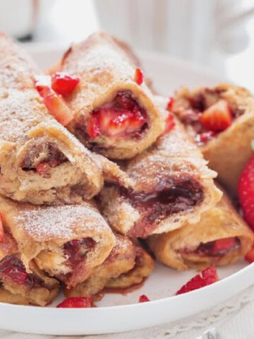 nutella and strawberry stuffed in bread for french toast roll ups.