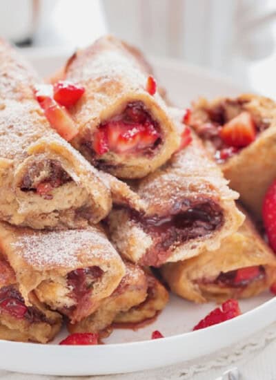 nutella and strawberry stuffed in bread for french toast roll ups.