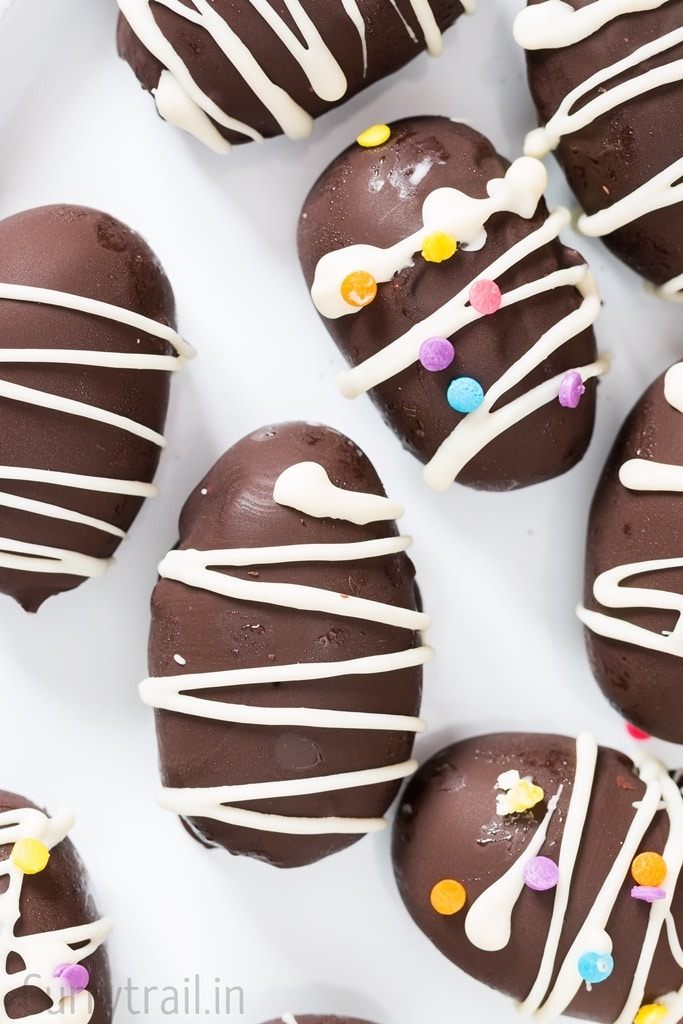 A few no bake OREO truffle eggs on a white plate