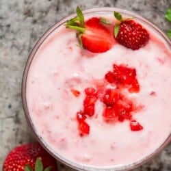 A bowl with strawberry Greek yogurt flavor