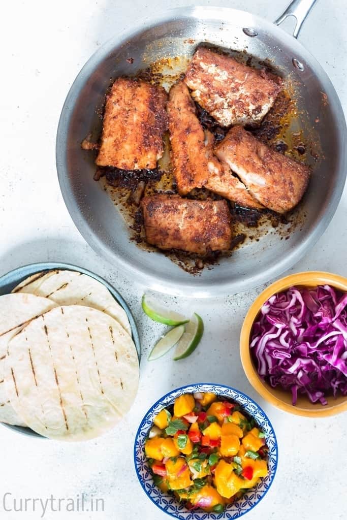 All toppings readily placed in bowls for making tilapia fish tacos recipe