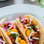 This easy tilapia fish tacos recipe with mango salsa is easy to make and the flavors in it is guaranteed to blow your mind. Are you ready for taco Tuesday? 30 minutes or less on the clock and you have the most delicious homemade tacos dinner to be served for dinner