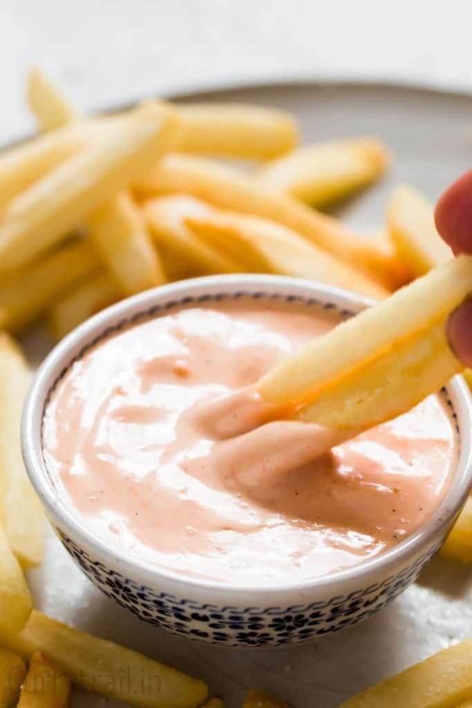 french fries dipped in boom boom sauce