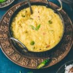 Unique egg dal served in black kadai garnished with green onions