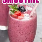 mixed berry smoothie in two tall glasses with text